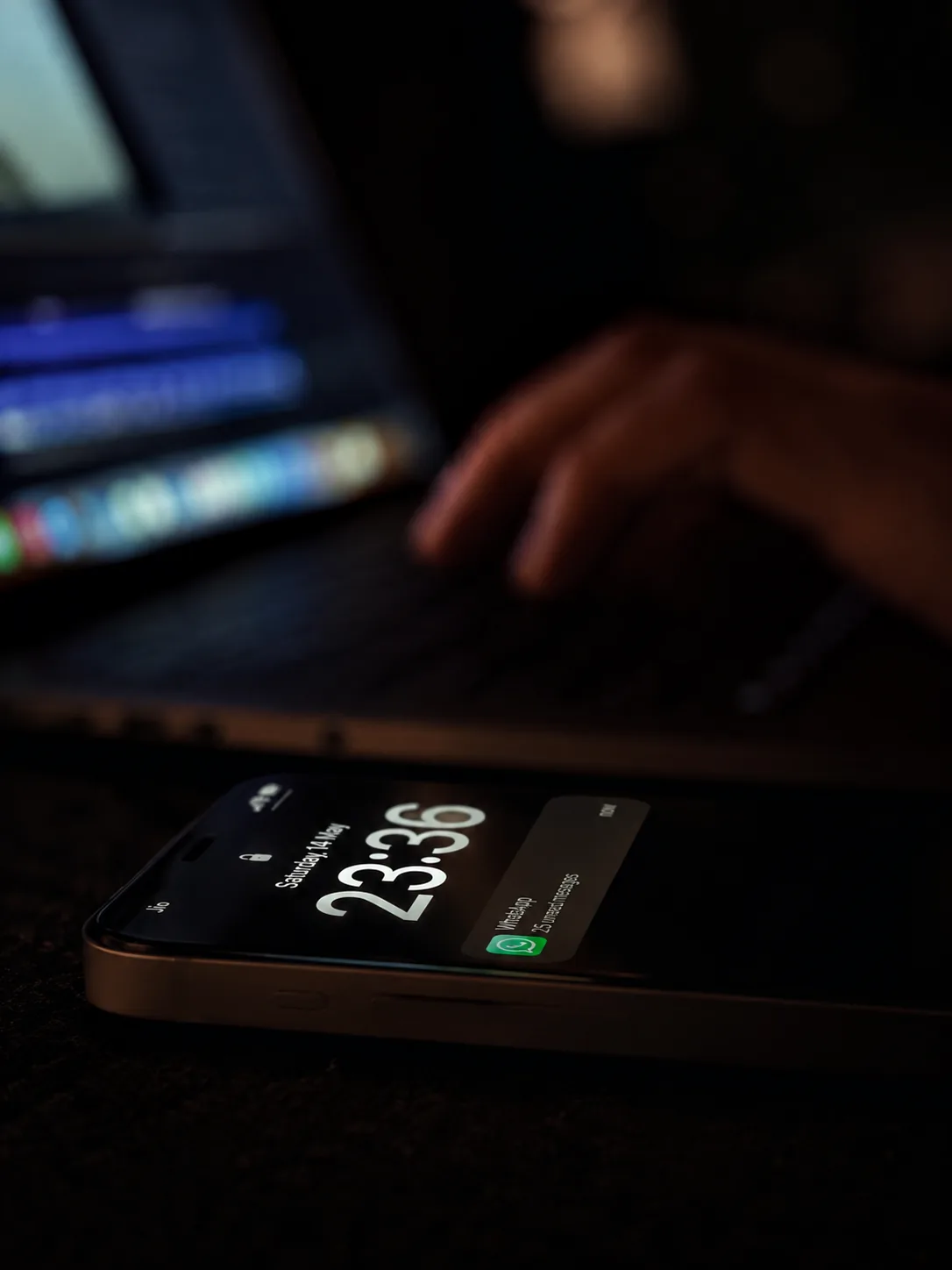 A customer's phone lighting up with unanswered shop messages at midnight